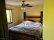 Comfortable bedroom with a ceiling fan and natural light from the window at 3167 El Cedro Cir, Las Vegas, NV 89121