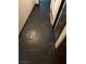 Hallway featuring striking stone flooring and a clean, neutral color palette with doors on each side at 3167 El Cedro Cir, Las Vegas, NV 89121