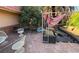 Comfortable patio area with furniture, a shade structure, and flagstone pavers, perfect for outdoor living and entertaining at 3167 El Cedro Cir, Las Vegas, NV 89121