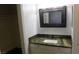 Bathroom with green marble countertop and ample storage space in the vanity at 3606 Gold Sluice Ave, North Las Vegas, NV 89032