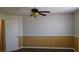 A well lit bedroom with a ceiling fan with carpet and textured walls at 3606 Gold Sluice Ave, North Las Vegas, NV 89032