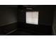 Dark bedroom features a ceiling fan with light and horizontal blinds on the window at 3606 Gold Sluice Ave, North Las Vegas, NV 89032