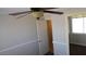 Bedroom featuring a ceiling fan, carpet flooring, and closet with a door at 3606 Gold Sluice Ave, North Las Vegas, NV 89032