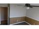 This bedroom offers a ceiling fan, neutral walls, and carpet flooring at 3606 Gold Sluice Ave, North Las Vegas, NV 89032