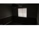 Dark bedroom features a ceiling fan with light and horizontal blinds on the window at 3606 Gold Sluice Ave, North Las Vegas, NV 89032