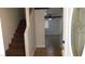 Open entryway with view to stairs and living room with tile flooring at 3606 Gold Sluice Ave, North Las Vegas, NV 89032