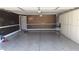 Finished garage with epoxy floor, water heater, and custom storage cabinets at 3606 Gold Sluice Ave, North Las Vegas, NV 89032