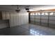 Spacious garage with epoxy flooring, cabinets, and garage door with opener at 3606 Gold Sluice Ave, North Las Vegas, NV 89032