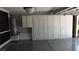 Clean garage with epoxy flooring and a full wall of storage cabinets at 3606 Gold Sluice Ave, North Las Vegas, NV 89032