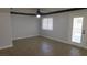 Spacious living room featuring tile flooring, ceiling fan, and natural light at 3606 Gold Sluice Ave, North Las Vegas, NV 89032