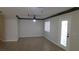 Living room with tile flooring, ceiling fan, and access to outdoor patio at 3606 Gold Sluice Ave, North Las Vegas, NV 89032