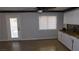 Open concept living space with tile floors and a view of the door and kitchen at 3606 Gold Sluice Ave, North Las Vegas, NV 89032