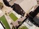 Aerial view shows the artificial turf in the desert landscaped backyard and tiled roof at 3736 Gallowtree Ave, North Las Vegas, NV 89081