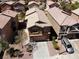 Aerial view showcasing the home, driveway, and desert landscaping in a neighborhood at 3736 Gallowtree Ave, North Las Vegas, NV 89081