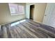 Bright bedroom featuring wood-look flooring, a closet, and a window at 3736 Gallowtree Ave, North Las Vegas, NV 89081