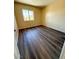 Cozy bedroom with wood floors and a window, offering a comfortable and inviting space at 3736 Gallowtree Ave, North Las Vegas, NV 89081
