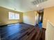 Spacious bonus room with wood floors and a large window, providing ample natural light at 3736 Gallowtree Ave, North Las Vegas, NV 89081