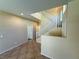 Inviting foyer featuring tile flooring, a staircase with white railings, and a neutral color palette at 3736 Gallowtree Ave, North Las Vegas, NV 89081