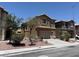 Attractive two-story home with a two-car garage, desert landscaping and tan stucco exterior at 3736 Gallowtree Ave, North Las Vegas, NV 89081