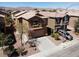 Two-story home featuring a neutral color palette, a tile roof, a two-car garage, and mature landscaping at 3736 Gallowtree Ave, North Las Vegas, NV 89081