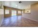 Open concept living area with tiled flooring, kitchen bar, and sliding door access to the backyard at 3736 Gallowtree Ave, North Las Vegas, NV 89081