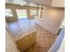 Bright, open living area with tile floors, sliding glass doors to the backyard, and neutral paint at 3736 Gallowtree Ave, North Las Vegas, NV 89081