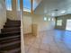 Open concept living area with tiled flooring and natural light at 3736 Gallowtree Ave, North Las Vegas, NV 89081