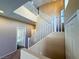 Bright, open staircase with white railing and neutral color walls at 3736 Gallowtree Ave, North Las Vegas, NV 89081