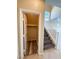 Under stairs storage with wood-look flooring and ample space, next to staircase at 3736 Gallowtree Ave, North Las Vegas, NV 89081
