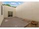 Enclosed backyard patio with a sliding glass door and neutral block wall at 3769 Fairlawn Ave, Las Vegas, NV 89121
