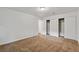 Spacious carpeted bedroom with a double door closet and ceiling light at 3769 Fairlawn Ave, Las Vegas, NV 89121