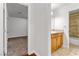 The image shows a spacious bedroom with carpeted floors and a bathroom nearby at 3769 Fairlawn Ave, Las Vegas, NV 89121