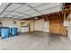 Spacious garage with laundry machines, storage, and a door to the backyard at 3769 Fairlawn Ave, Las Vegas, NV 89121