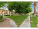 Well-maintained lawn with mature trees and paved walkways at 3769 Fairlawn Ave, Las Vegas, NV 89121
