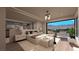 Spacious bedroom with modern decor, sitting area, a balcony, and a view of the desert landscape at 3961 Heron Fairway Dr, Las Vegas, NV 89141