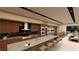 Modern kitchen with sleek cabinetry, marble counters, and stainless steel appliances at 4086 Heron Fairway, Las Vegas, NV 89141