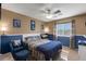 Comfortable bedroom with plush carpets, ample natural light, and scenic views at 4415 Peaceful Harbor St, Las Vegas, NV 89129