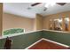 Bonus room with hardwood floors featuring views into the surrounding green landscape at 4415 Peaceful Harbor St, Las Vegas, NV 89129