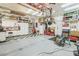 Spacious garage with ample storage, work area, and a checkered floor section at 4415 Peaceful Harbor St, Las Vegas, NV 89129