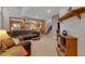 Inviting living room with tiled floors, comfortable seating, and an open staircase at 4415 Peaceful Harbor St, Las Vegas, NV 89129