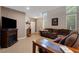 Inviting living room featuring a fireplace, tile floors, and ample natural light at 4415 Peaceful Harbor St, Las Vegas, NV 89129