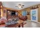 Cozy living room with wood accents and natural light with a view of the backyard at 4415 Peaceful Harbor St, Las Vegas, NV 89129