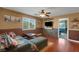 Comfortable living room featuring hardwood floors and a ceiling fan at 4415 Peaceful Harbor St, Las Vegas, NV 89129