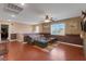 Upstairs loft area with hardwood floors, natural light, and a ceiling fan at 4415 Peaceful Harbor St, Las Vegas, NV 89129