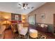 Spacious main bedroom featuring a wooden accent wall, vaulted ceilings, and a cozy seating area at 4415 Peaceful Harbor St, Las Vegas, NV 89129