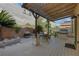 Outdoor kitchen featuring built in BBQ grill, dining area, and covered patio at 4415 Peaceful Harbor St, Las Vegas, NV 89129