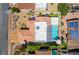 Aerial view shows the pool and patio area along with desert landscaping at 444 Viewmont Dr, Henderson, NV 89015