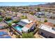 View of home with a sparkling pool, covered patio and a mountain backdrop at 444 Viewmont Dr, Henderson, NV 89015