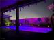 Beautiful backyard pool area with decorative lighting, desert landscaping, and a covered patio at 444 Viewmont Dr, Henderson, NV 89015