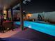 Beautiful backyard with a sparkling pool, desert-inspired decor, and a covered patio area at 444 Viewmont Dr, Henderson, NV 89015